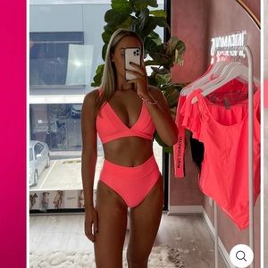 Infamous swim Lola set in fluorescent coral